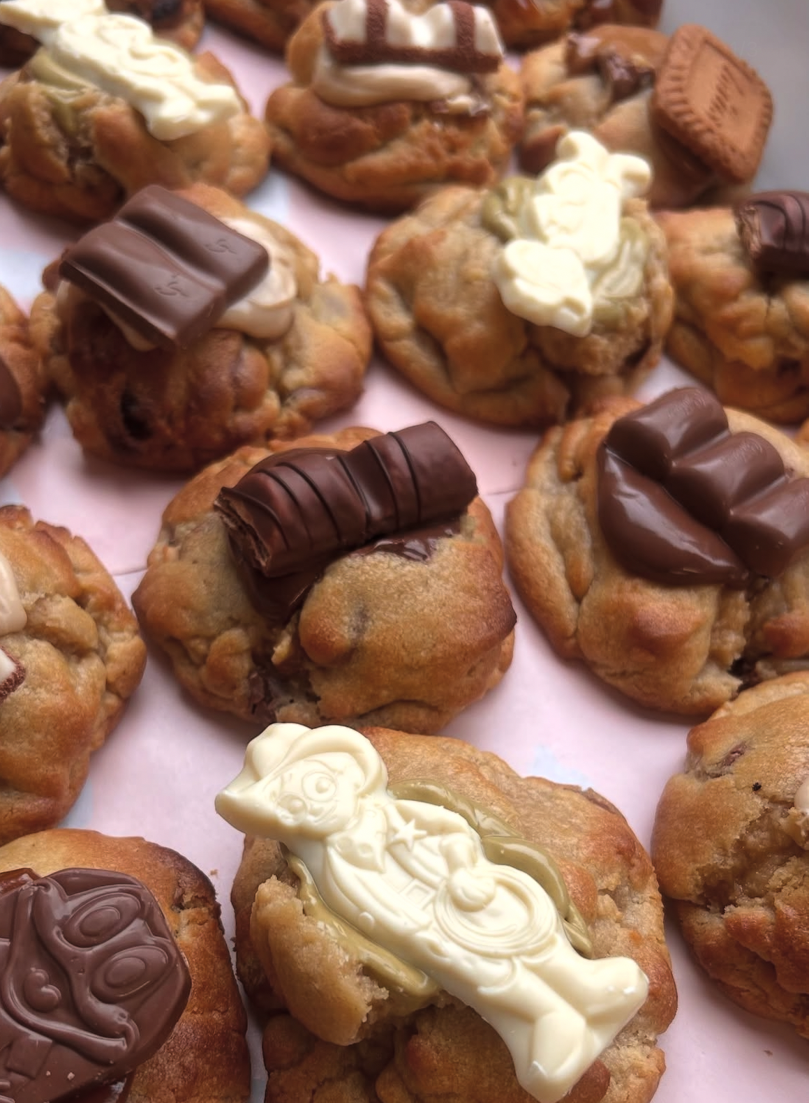 Pistachio Milkybar stuffed cookie topped with white chocolate and Milkybar kid